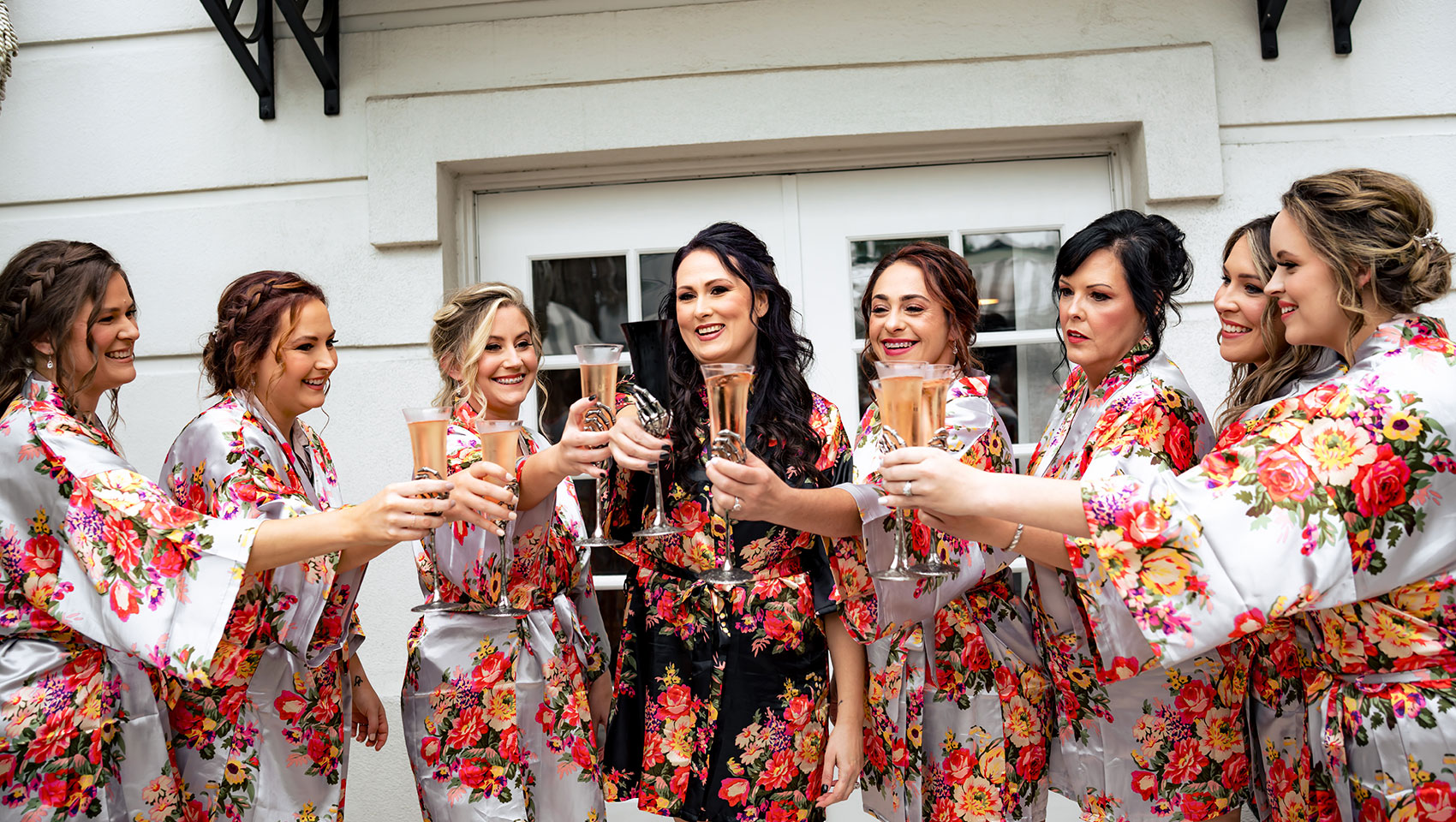 Bride & Bridesmaids with celebratory cocktails